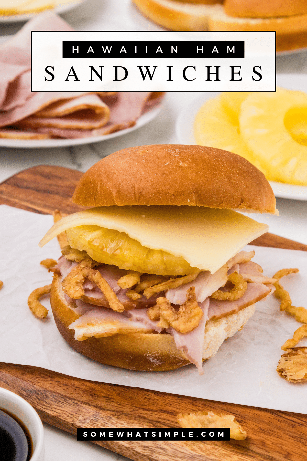 Hawaiian ham sandwiches are made with slices of baked ham and pineapple then topped with fried onions and teriyaki sauce all on a sweet King's Hawaiian roll.  Once you've had one, you'll never eat a ham sandwich any other way. #hawaiianhamsandwich #hawaiianhamandcheesesandwich #hawaiianrollhamandcheesesliders #hawaiianrollhamsandwich #hamandcheesehawaiianrolls via @somewhatsimple