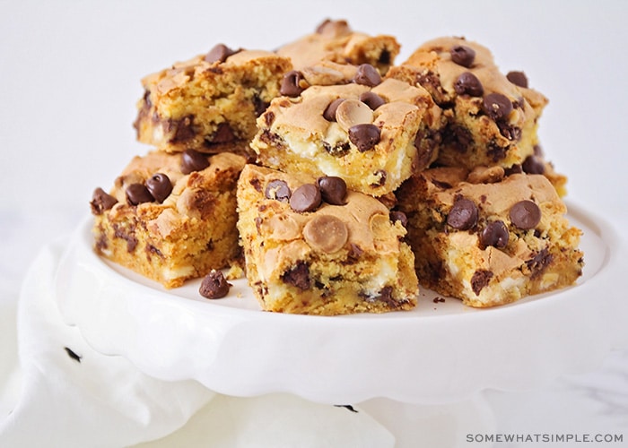 a cake stand filled with cake mix cookie bars