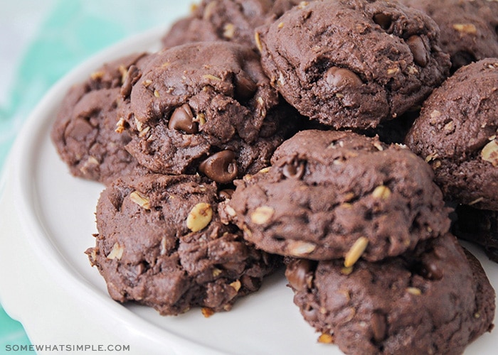 a pile of devils food cake mix cookies on a white cake stand