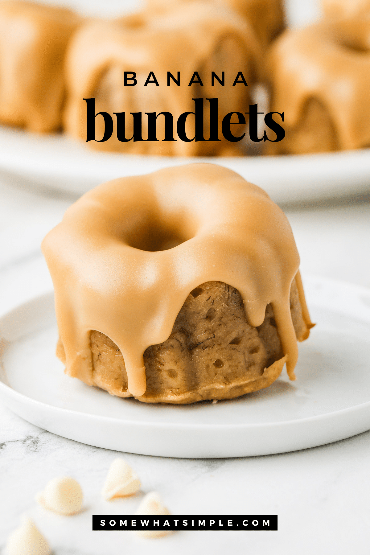 Moist banana bundtlets with maple white chocolate icing—easy, kid-friendly, and perfect for sharing! via @somewhatsimple