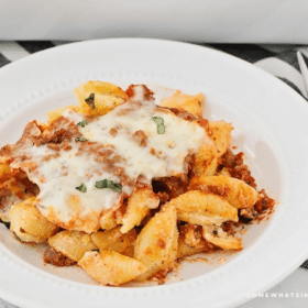 unstuffed shells being served on a white plate