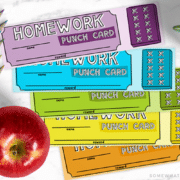 looking down on a purple, blue, green, yellow and orange homework punch card that can also be used as a bookmark