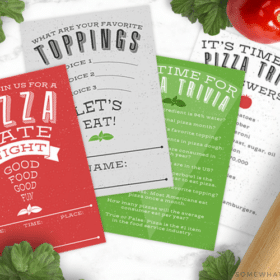 pizza date night invitation and printables on the counter with tomatoes, basil and a rolling pin