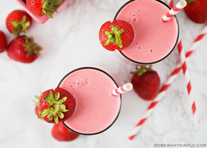 looking down on two glasses filled with a copycat strawberry Julius recipe