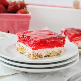 two squares of a strawberry pretzel dessert