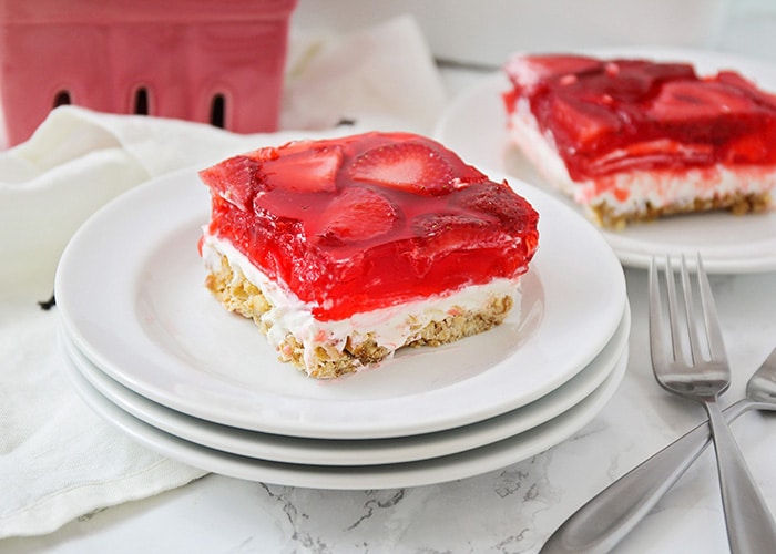 a serving of a dessert made with strawberries, jello and pretzels