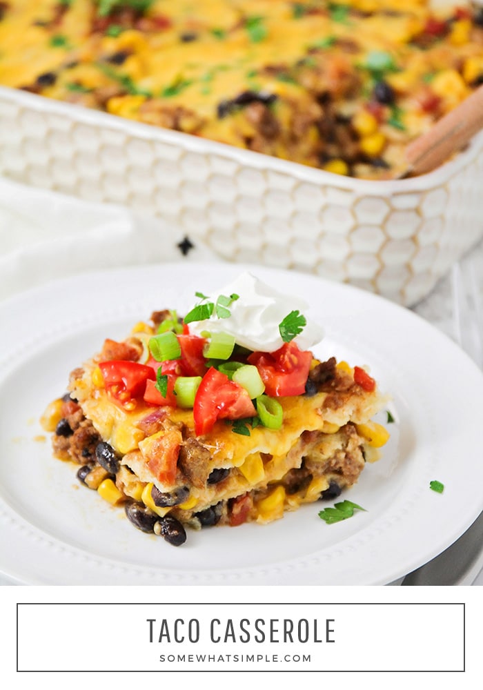 a close up of a serving of taco casserole with a pan filled in the background