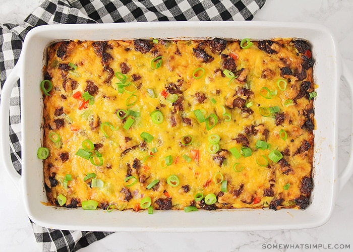 looking down on a freshly baked tater tot breakfast casserole topped with chopped green onions