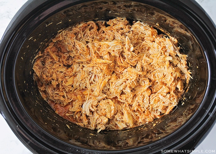 shredded buffalo chicken in a slow cooker