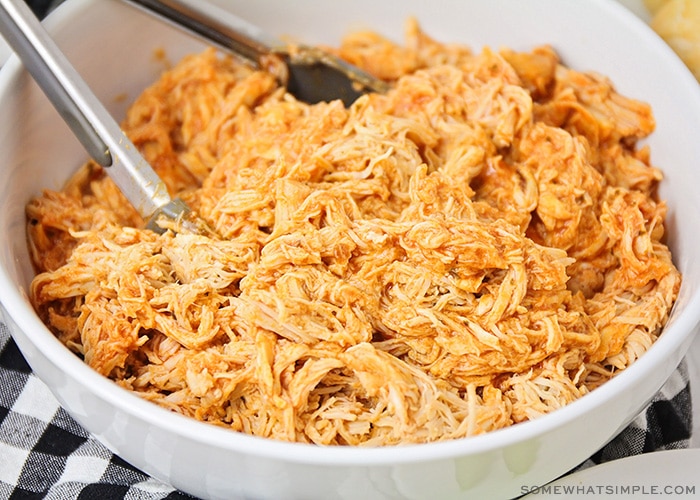 shredded buffalo chicken in a white bowl