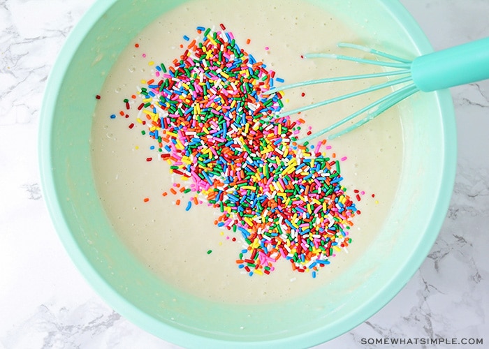 looking down on a bowl of pancake batter with sprinkles