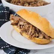 a shredded roast beef sandwich on a french roll