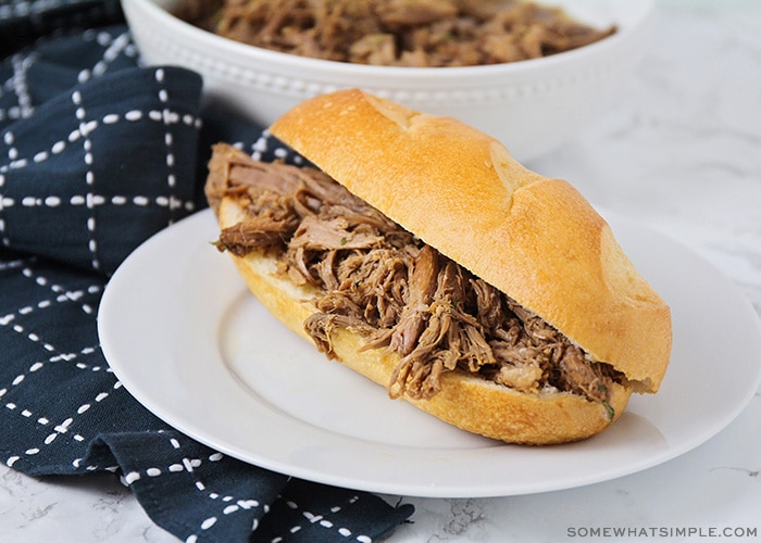 a shredded roast beef sandwich on a french roll