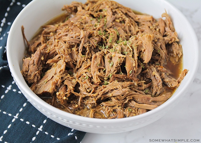 a bowl filled with shredded roast beef