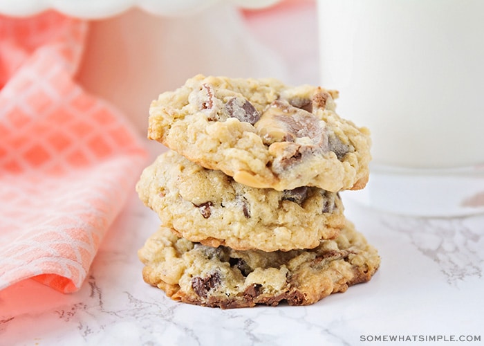 a stack of turtle oatmeal cookies on a counter