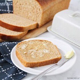a slice of homemade wheat bread topped with butter