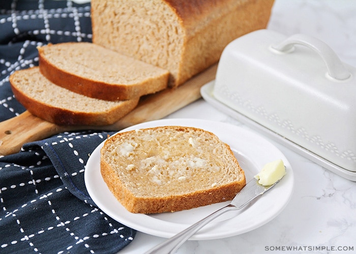 a slice of homemade wheat bread topped with butter