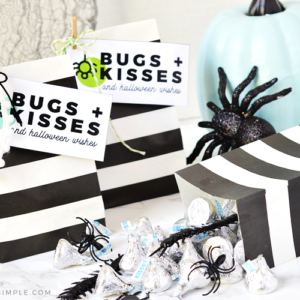 halloween gift bags with bugs and kisses tags attached