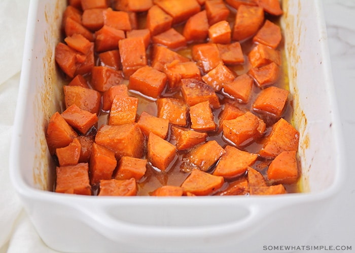 a baking pan of candied yams in a brown sugar glaze