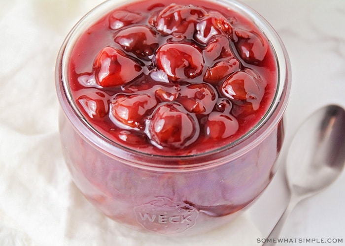 a jar of homemade cherry pie filling