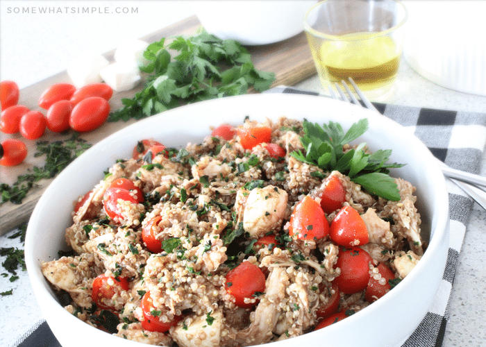 a bowl filled with Caprese quinoa salad