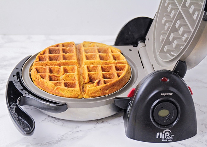 a freshly cooked gingerbread waffle in a waffle maker