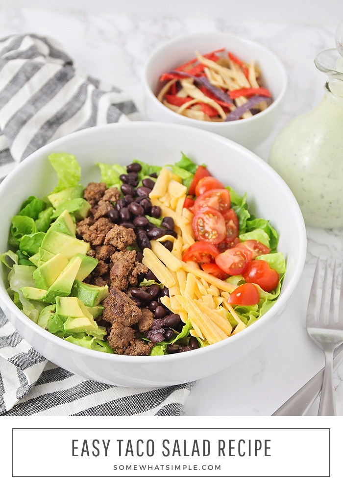 This simple and delicious taco salad recipe is ready in less than 20 minutes. Made with crunchy lettuce, ground beef and healthy vegetables, it's sure to please even the pickiest of eaters! #tacosalad #tacosaladrecipe #easytacosaladrecipe #tacosaladdressing #healthytacosalad via @somewhatsimple