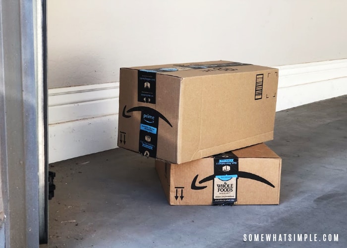 2 amazon boxes stacked in a garage