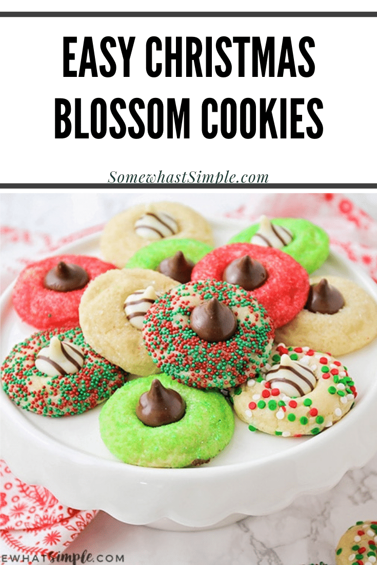 These Christmas blossom cookies are a fun and delicious way to spread some holiday cheer!  Made with your favorite sugar cookie dough, Christmas decorations and a Hershey's Kiss, these cookies are irresistible! These are so easy, they take only minutes to prepare but look like you've been baking all day! via @somewhatsimple