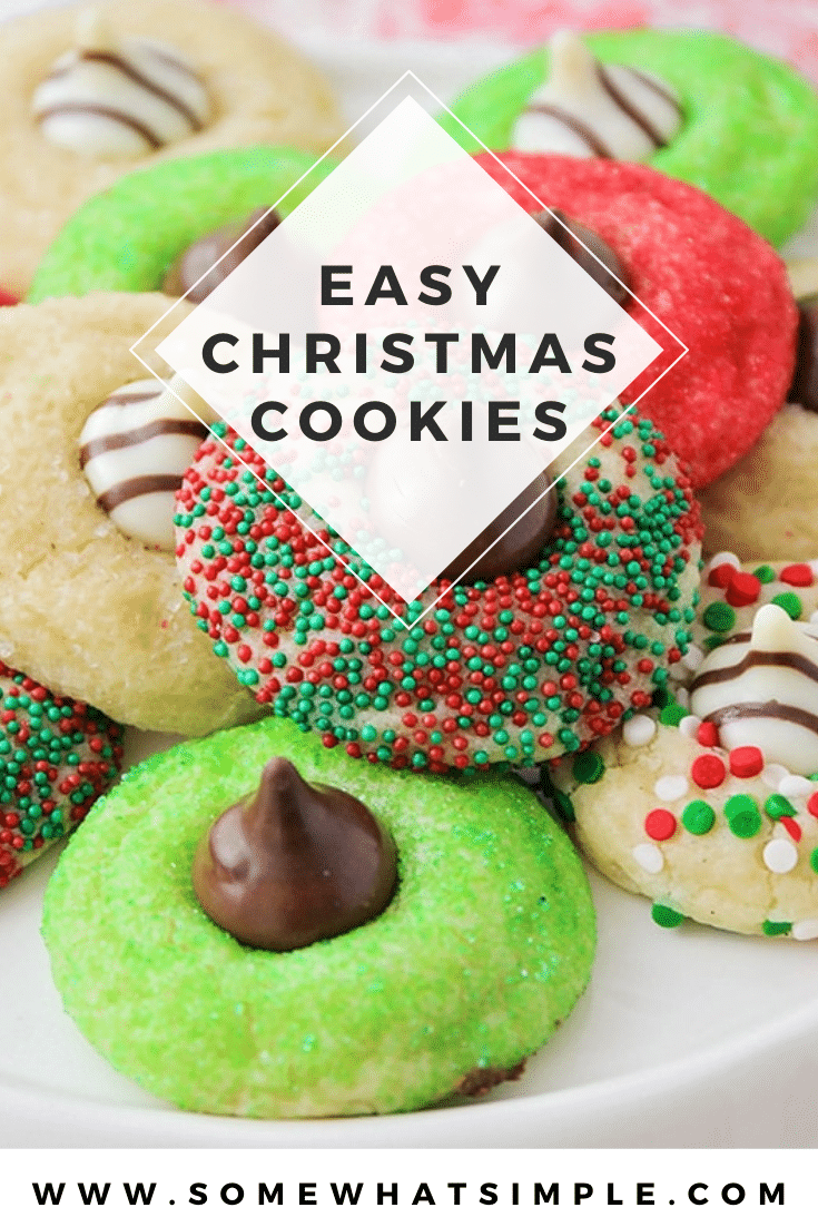 These Christmas blossom cookies are a fun and delicious way to spread some holiday cheer!  Made with your favorite sugar cookie dough, Christmas decorations and a Hershey's Kiss, these cookies are irresistible! These are so easy, they take only minutes to prepare but look like you've been baking all day! via @somewhatsimple