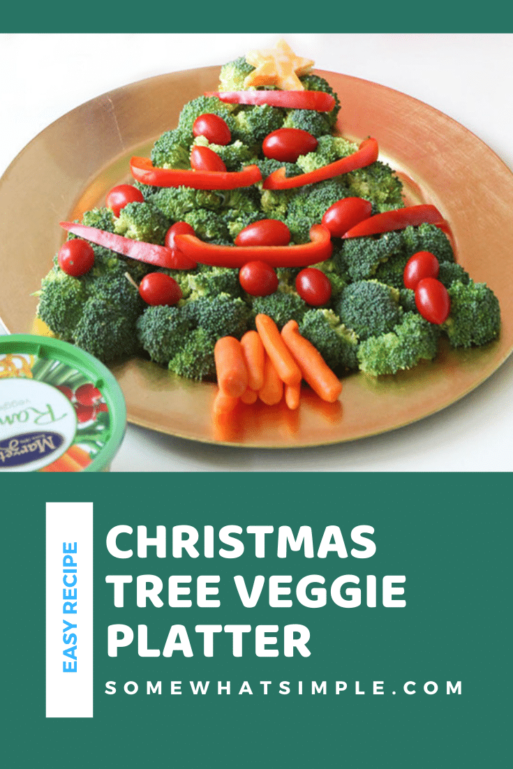 This Christmas tree veggie tray is simple and easy to make. The kids will love helping you arrange the veggies on the tray to make a fun Christmas tree shape that's perfect for the holidays. This veggie tray idea is simple and festive and makes the perfect holiday appetizer. via @somewhatsimple