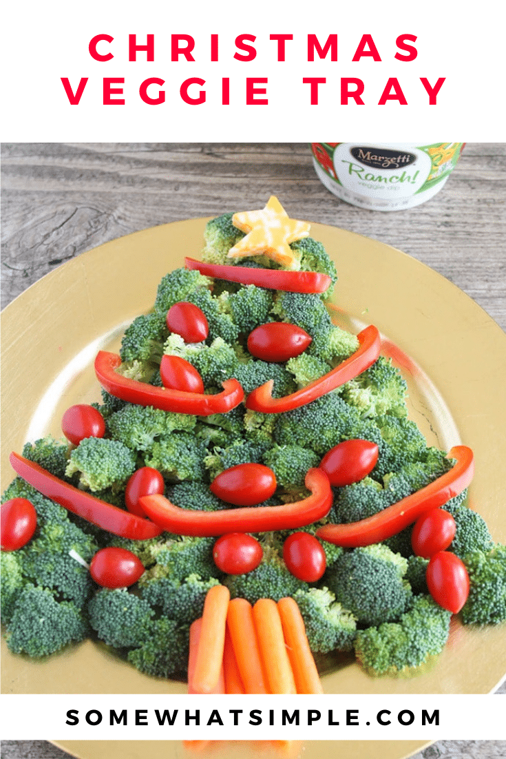 This Christmas tree veggie tray is simple and easy to make. The kids will love helping you arrange the veggies on the tray to make a fun Christmas tree shape that's perfect for the holidays. This veggie tray idea is simple and festive and makes the perfect holiday appetizer. via @somewhatsimple