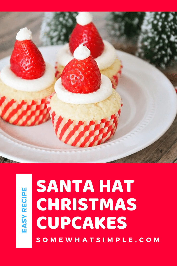 Santa hat cupcakes are a fun and festive dessert to serve during the Christmas holidays.  Topped with a fresh strawberry and homemade frosting, you won't be able to just eat one of these cupcakes. These are the perfect festive dessert idea to serve at your next Christmas party. via @somewhatsimple