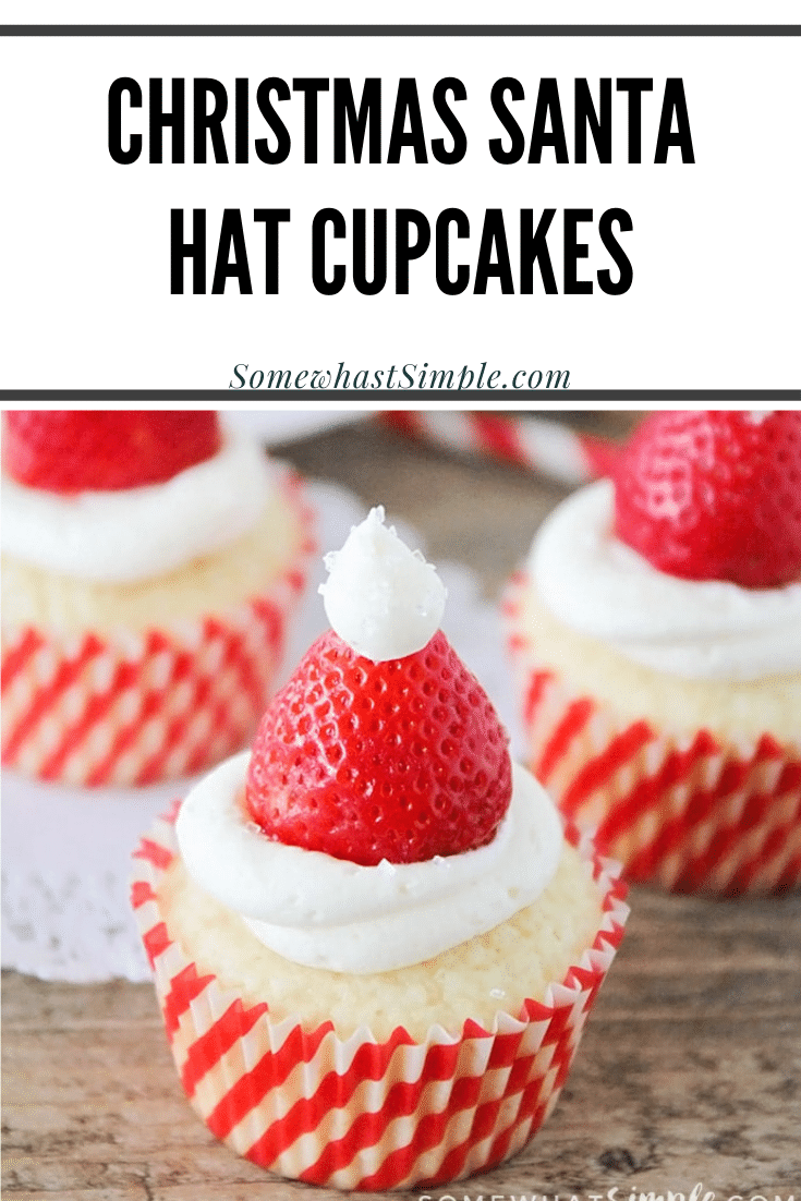 Santa hat cupcakes are a fun and festive dessert to serve during the Christmas holidays.  Topped with a fresh strawberry and homemade frosting, you won't be able to just eat one of these cupcakes. These are the perfect festive dessert idea to serve at your next Christmas party. via @somewhatsimple