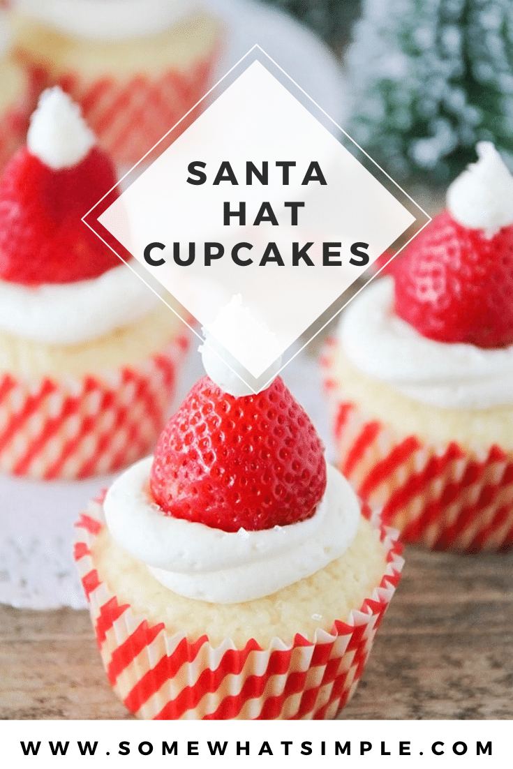 Santa hat cupcakes are a fun and festive dessert to serve during the Christmas holidays.  Topped with a fresh strawberry and homemade frosting, you won't be able to just eat one of these cupcakes. These are the perfect festive dessert idea to serve at your next Christmas party. via @somewhatsimple