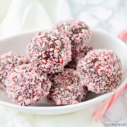 a bowl filled with protein truffles covered in candy canes