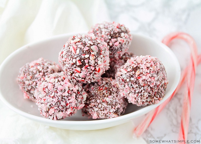 a bowl filled with protein truffles covered in candy canes