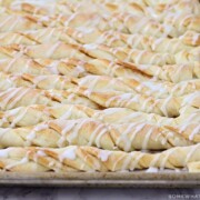 cinnamon bread twists with icing drizzled over the top