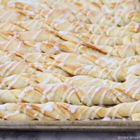 cinnamon bread twists with icing drizzled over the top