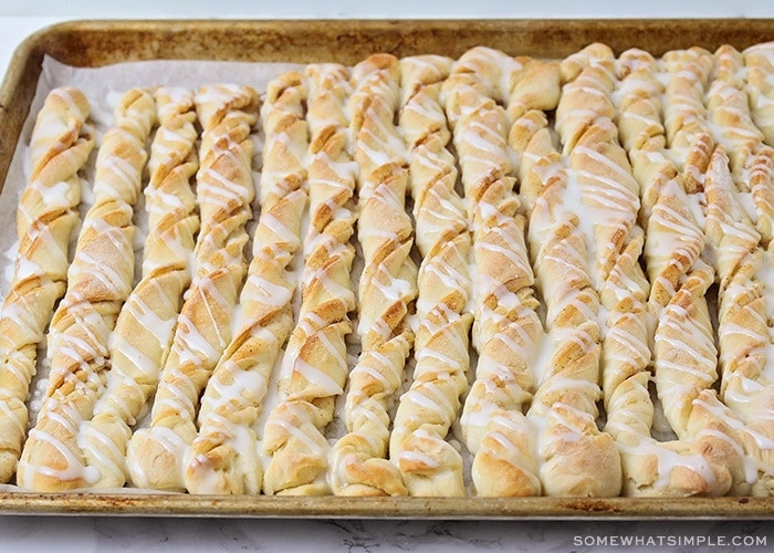 freshly baked cinnamon bread twisted and covered with icing