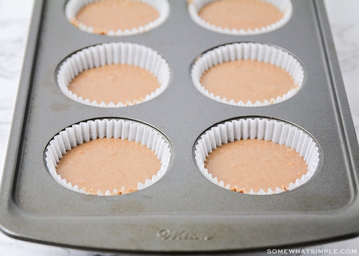 uncooked cupcake batter in a muffin tin