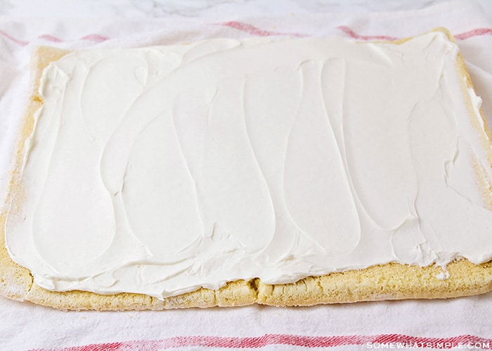 cream cheese filling spread over a rectangle cake