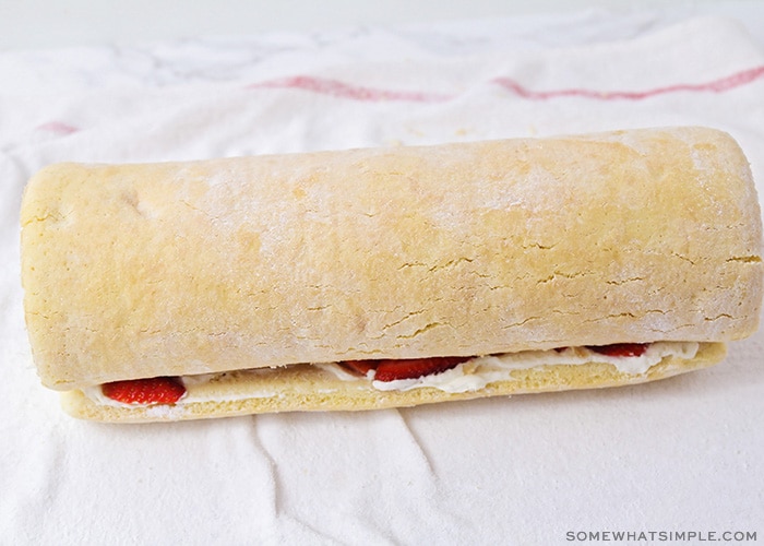 a strawberry shortcake roll on a towel