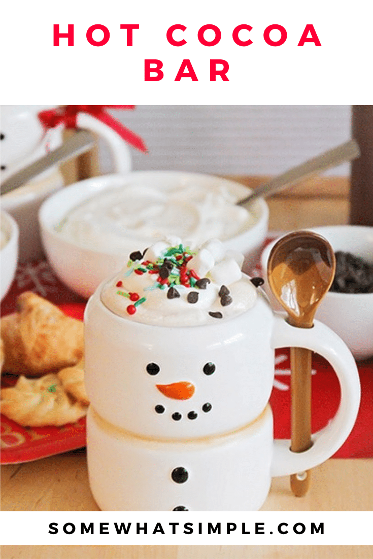 This sweet hot cocoa bar is a fun way to celebrate the season! Set out mix-ins, serve treats on the side, and enjoy a cup of holiday cheer! It's perfect to serve at your next holiday party or set it out for the family as a Christmas treat. via @somewhatsimple