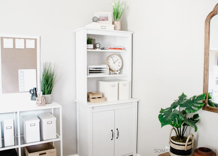 a cabinet and shelving unit for a home office