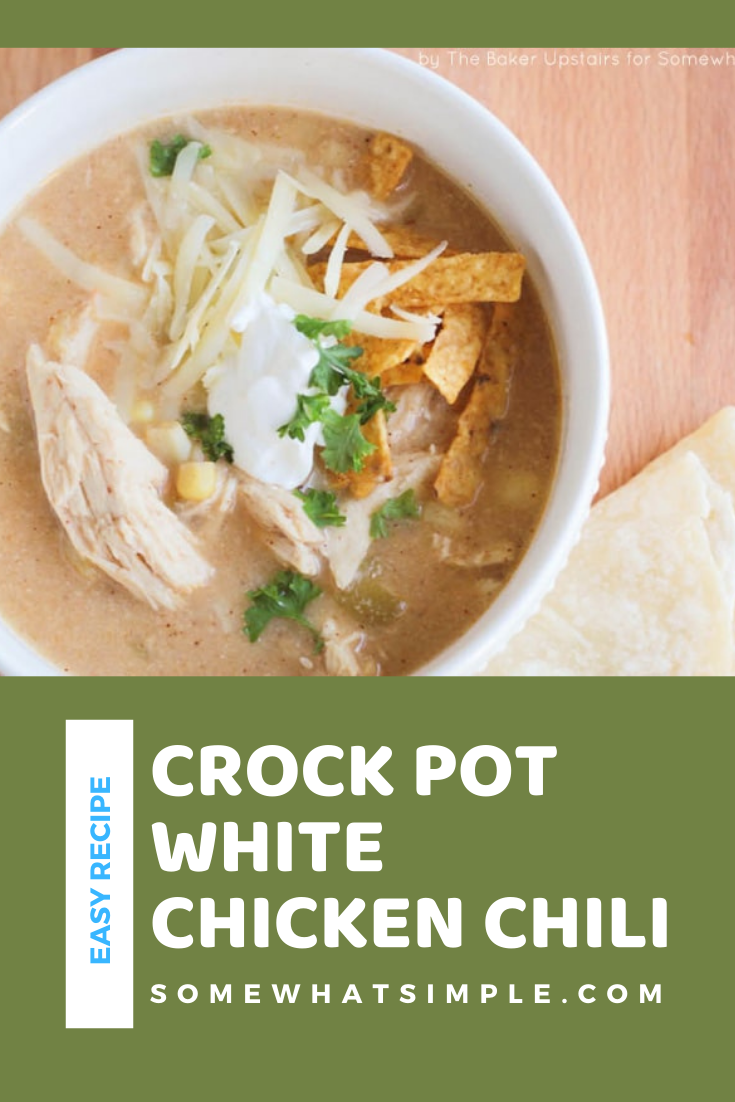 This slow cooker white chicken chili recipe is the perfect dinner on a chilly day.  Filled with tender chicken, white beans, vegetables and cream cheese, it doesn't get any better than this comfort food! via @somewhatsimple