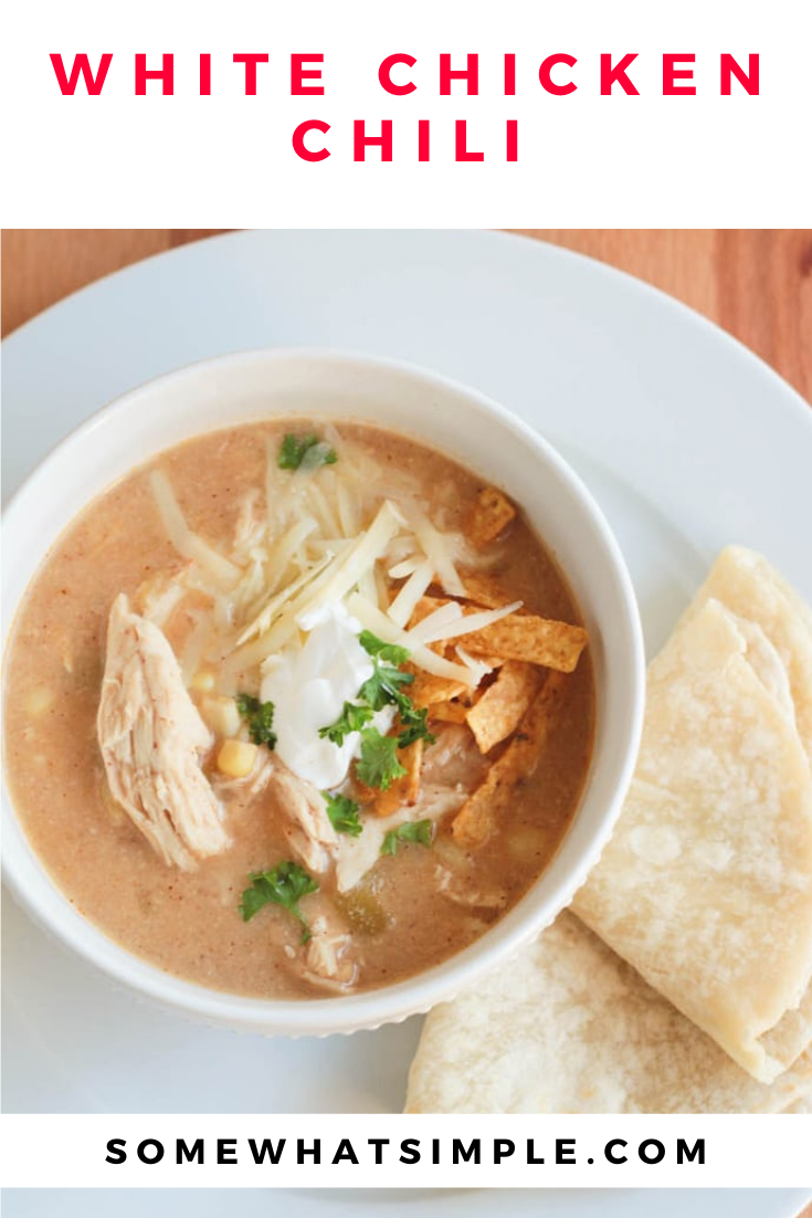 This slow cooker white chicken chili recipe is the perfect dinner on a chilly day.  Filled with tender chicken, white beans, vegetables and cream cheese, it doesn't get any better than this comfort food! via @somewhatsimple