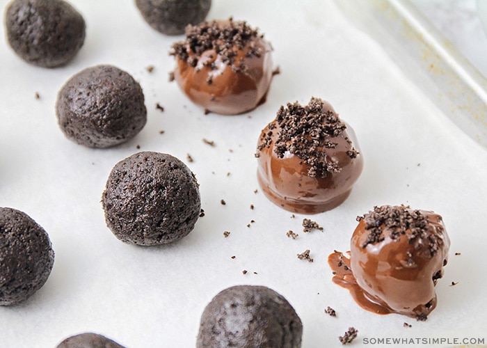 Oreo cookie balls that have been dipped in chocolate