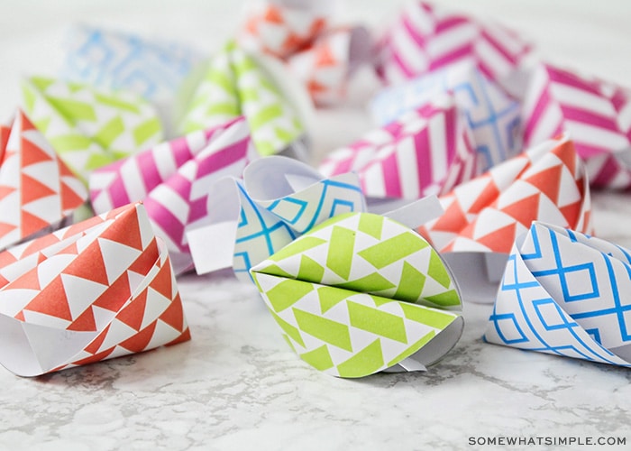 brightly colored fortune cookies made out of paper