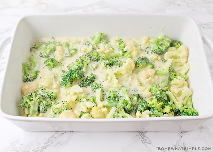 a broccoli and cauliflower mixture in a baking pan